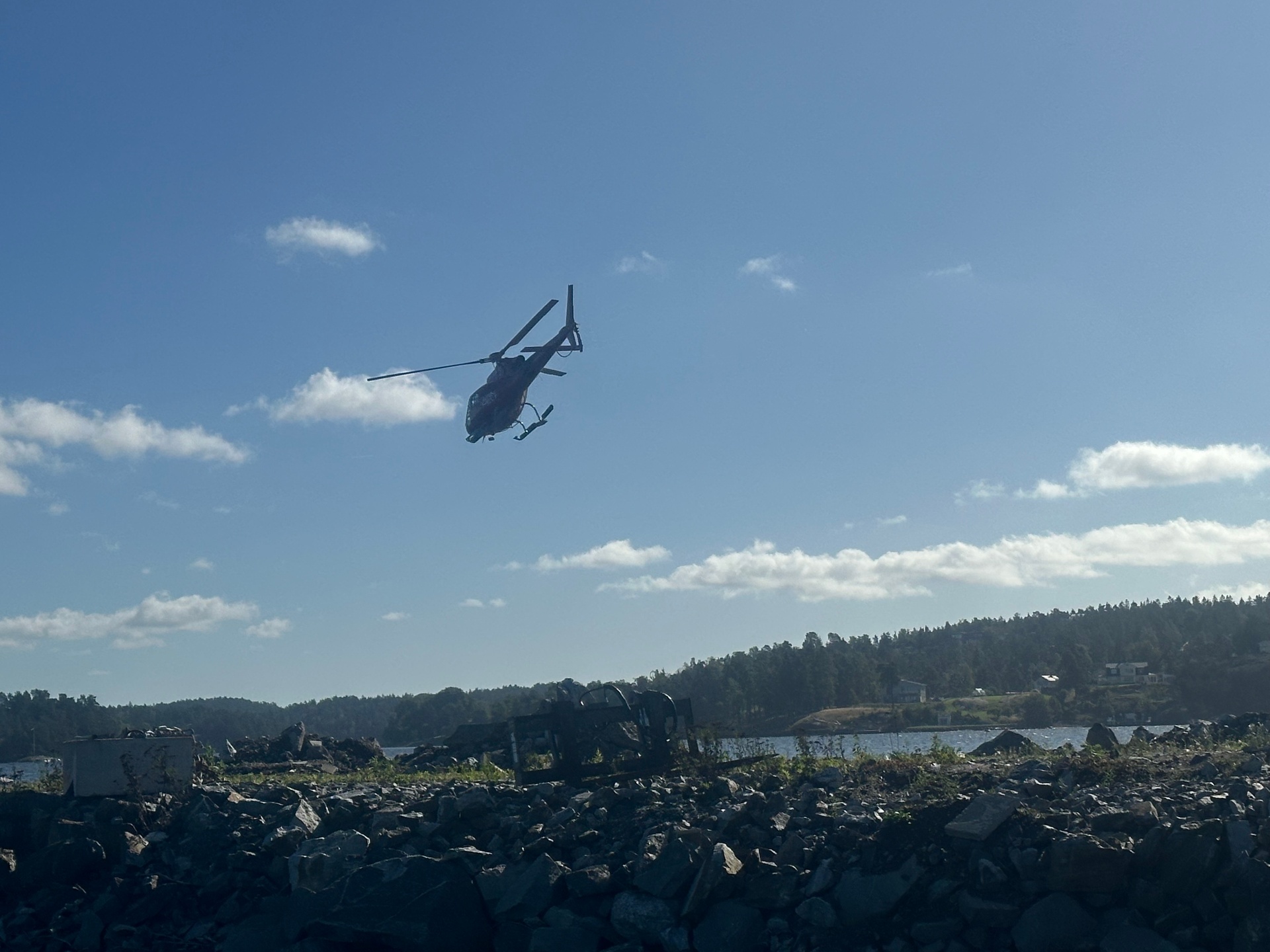 Helicopter over forest land