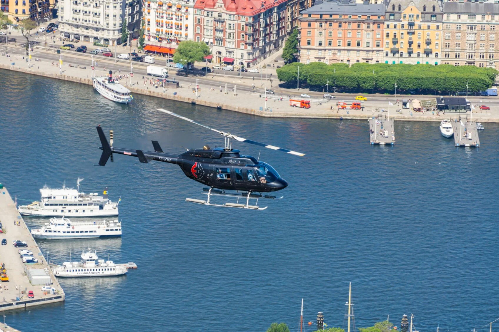 Helicopter on a sightseeing tour over Strandvägen and the Stockholm inner city
