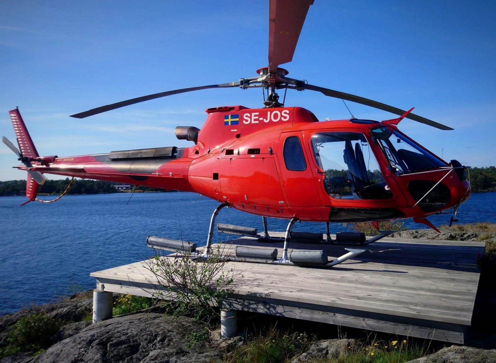 AS350 SE-JOS on a helipad in the Stockholm archipelago