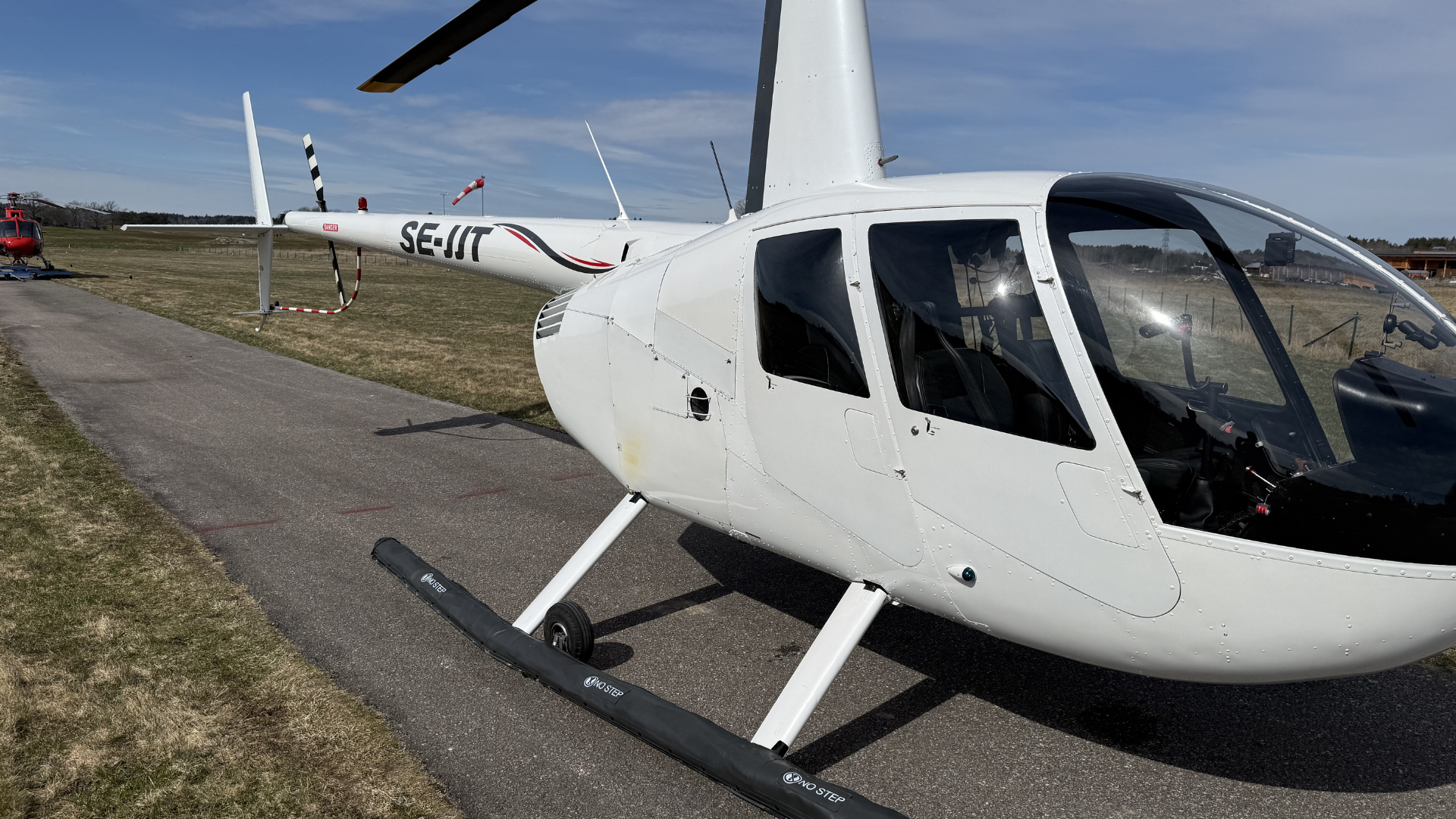 Robinson R44 SE-IJT at Åkersberga airfield