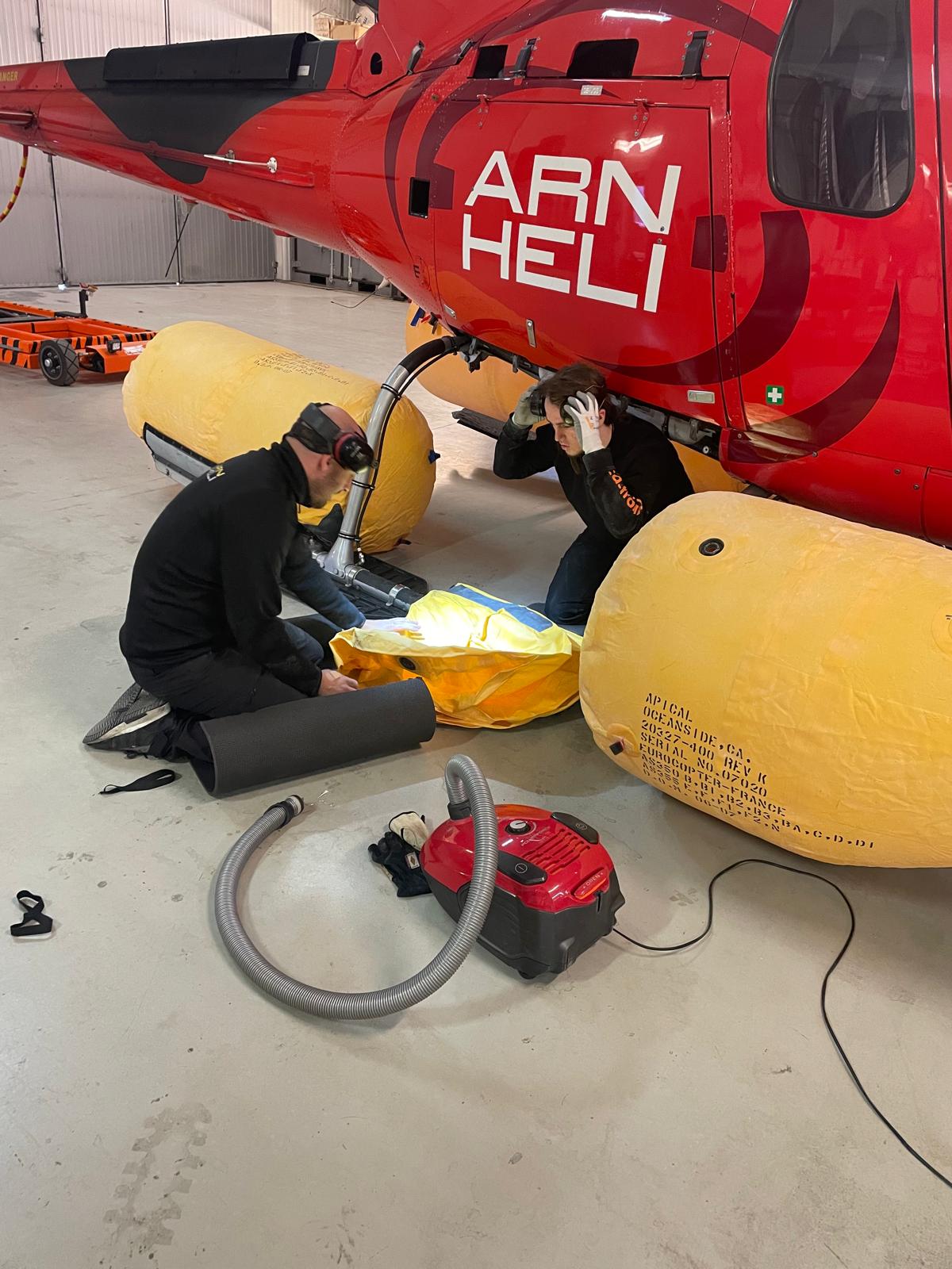 Arlanda Helicopter aircraft technicians performing maintenance in the hangar