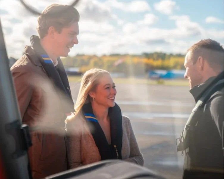 Couple greeting the pilot before departure on a private helicopter tour